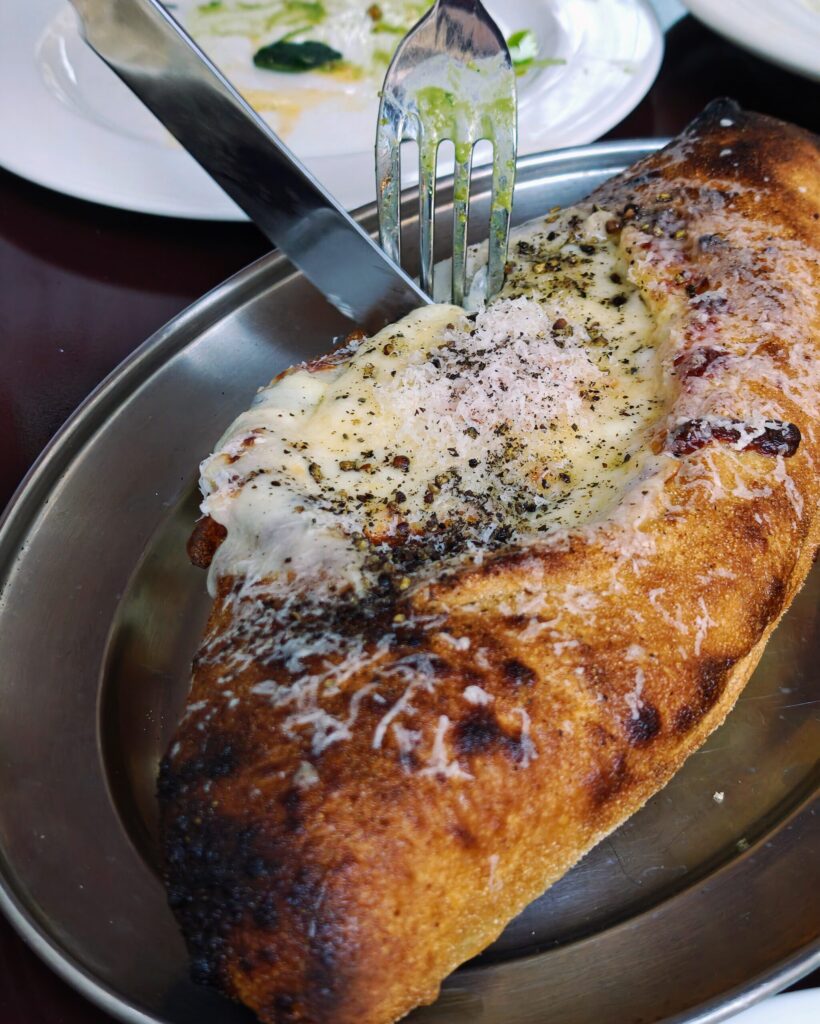 Khachapuri - Fermented koji-dough pizzetta - baked egg, molten Cheese, black pepper at Holy Carrot Bistro